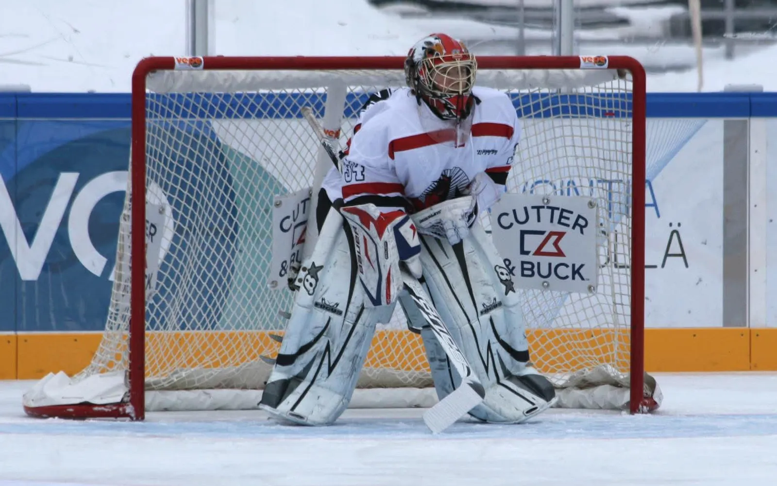 A young Sanni Ahola tending goal for EHC Pojat at an outdoor game on the Helsinki Olympic Stadium ice